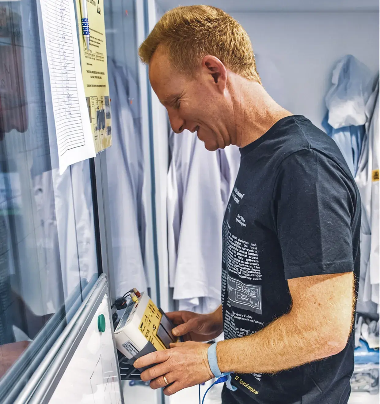 Team member demonstrating a device at an exhibition window